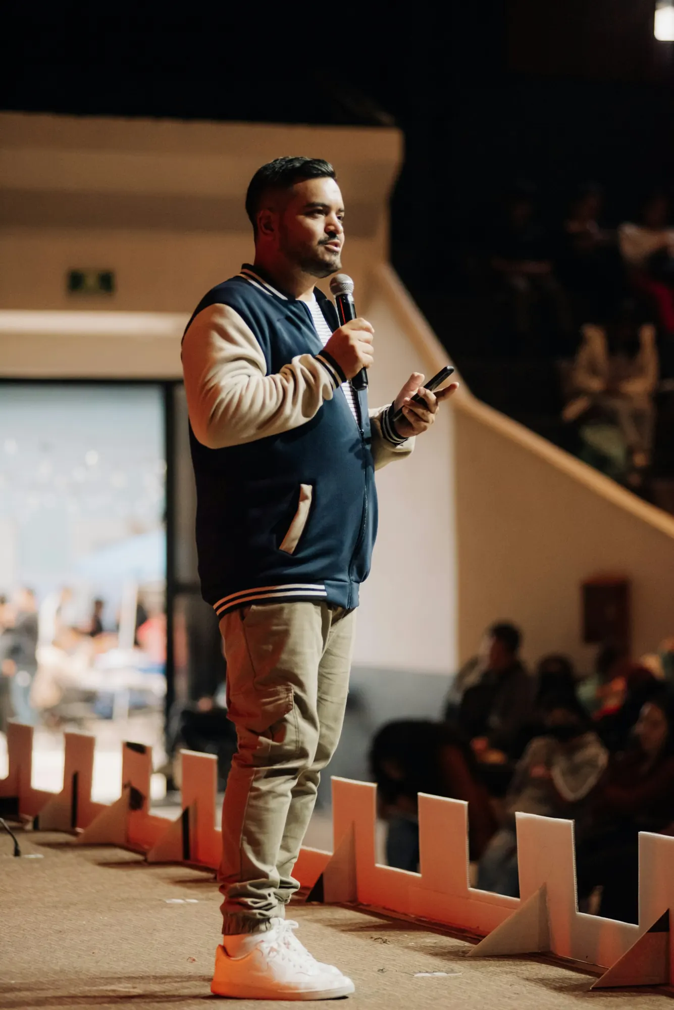 A pastor preaching with a microphone