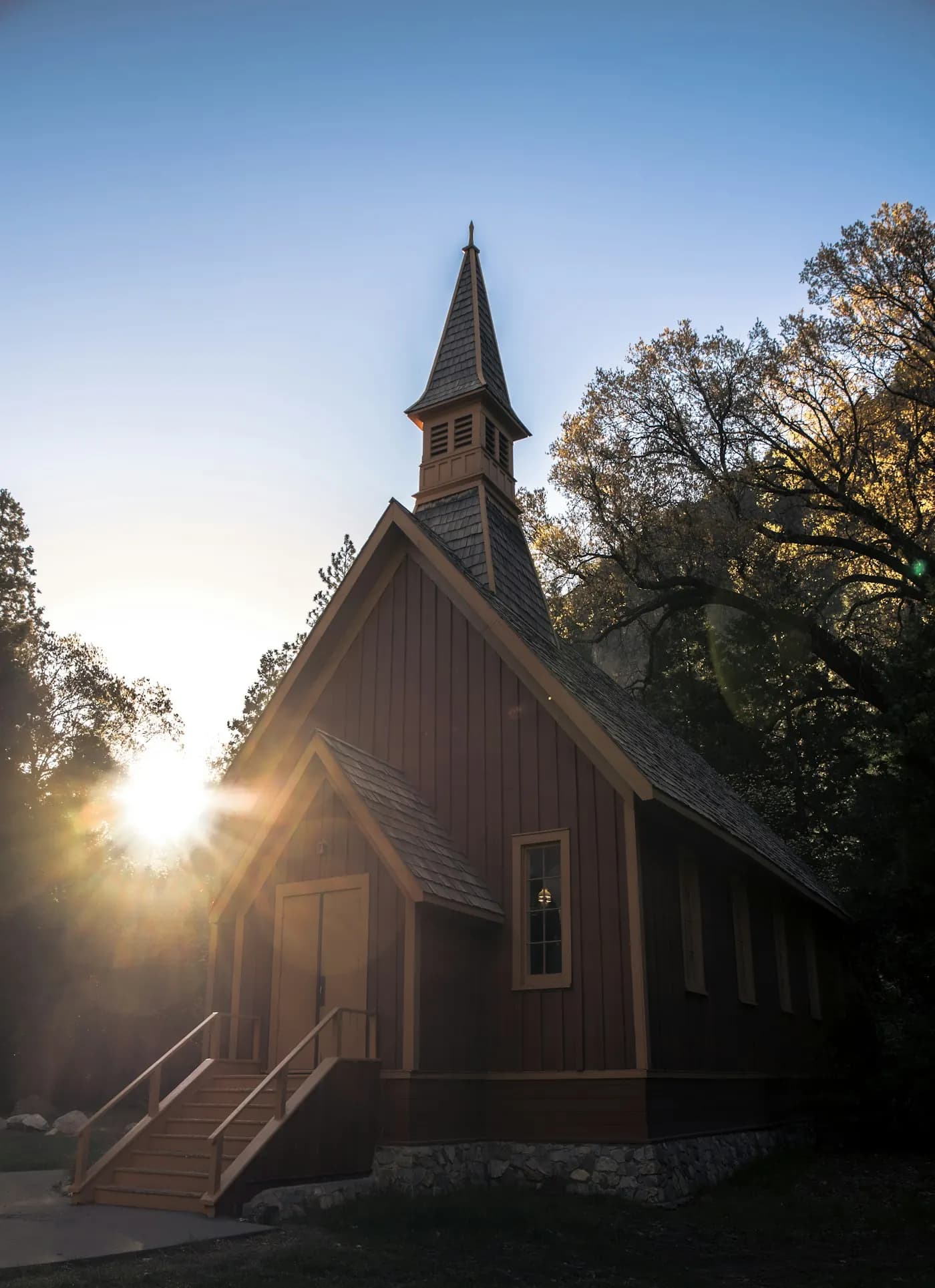 A wooden church steeple in warm light