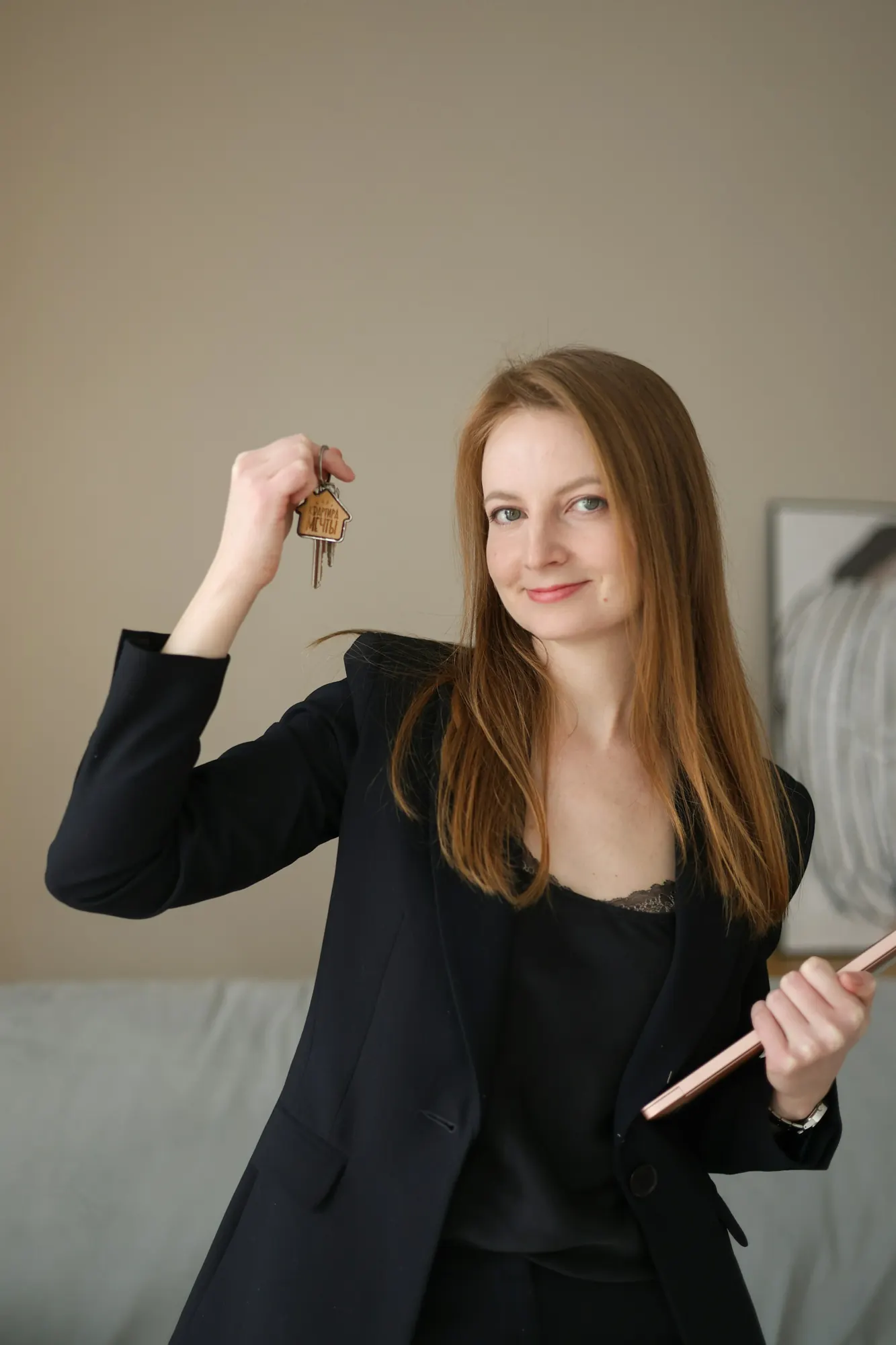 A real estate agent holding a set of house keys
